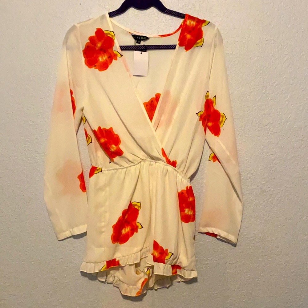 White flowered long sleeved romper